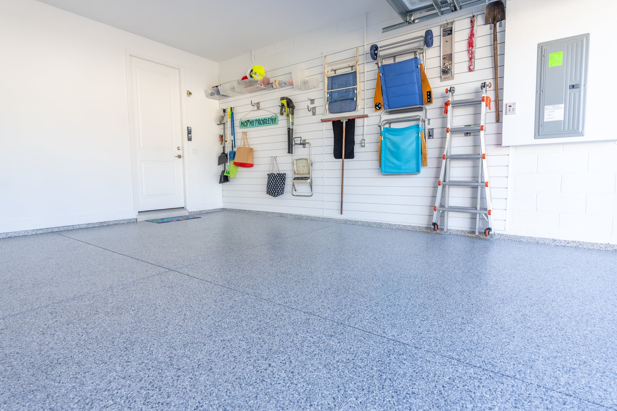 A Jeep parked on a freshly installed Penntek flake floor coating